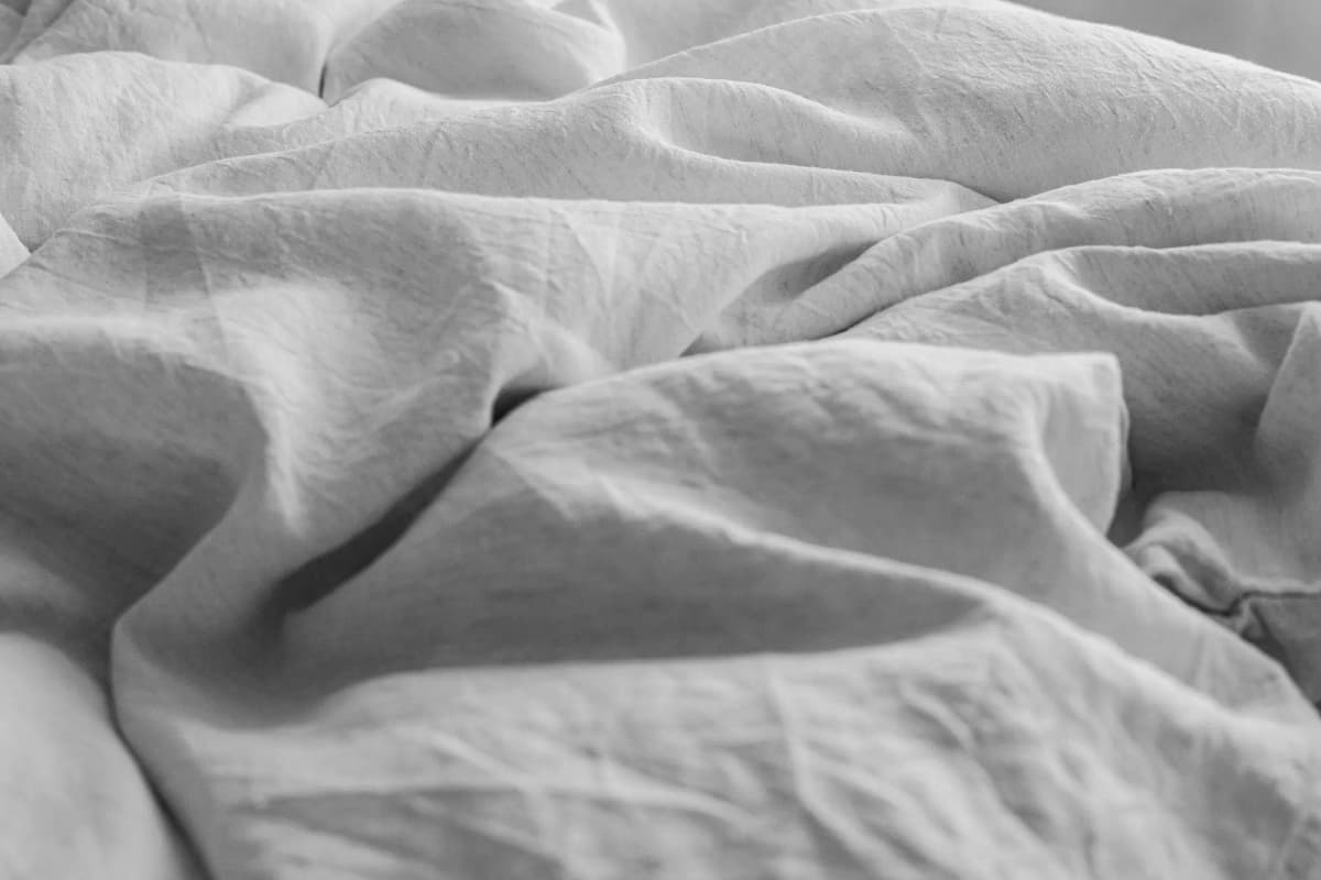 Close-up of soft folds in white linen