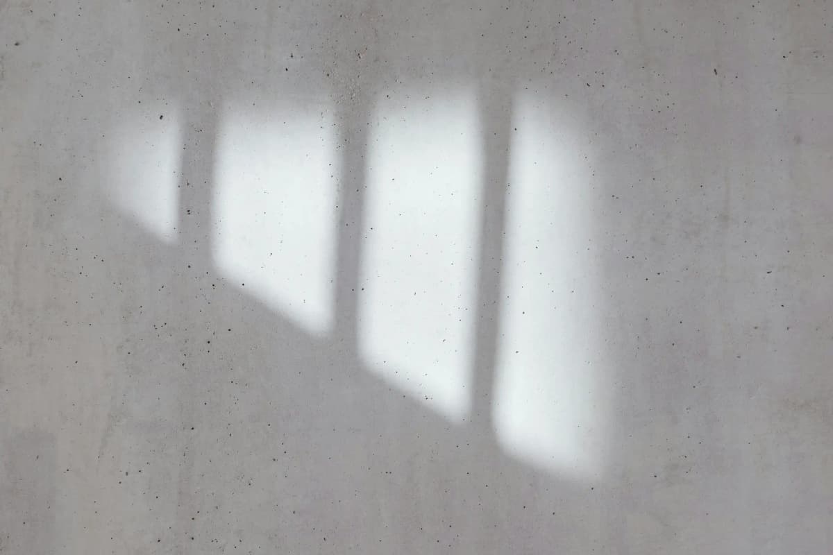 Soft window light on a plaster wall